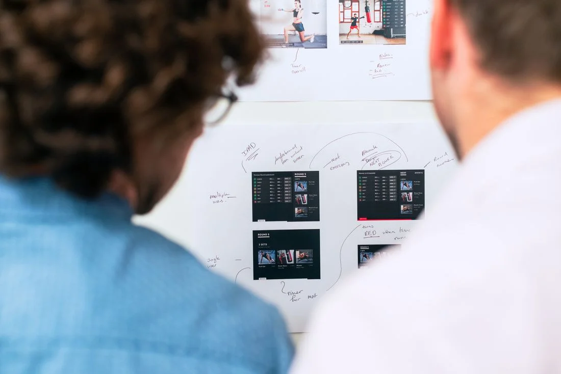 Engineers planning an application on a whiteboard